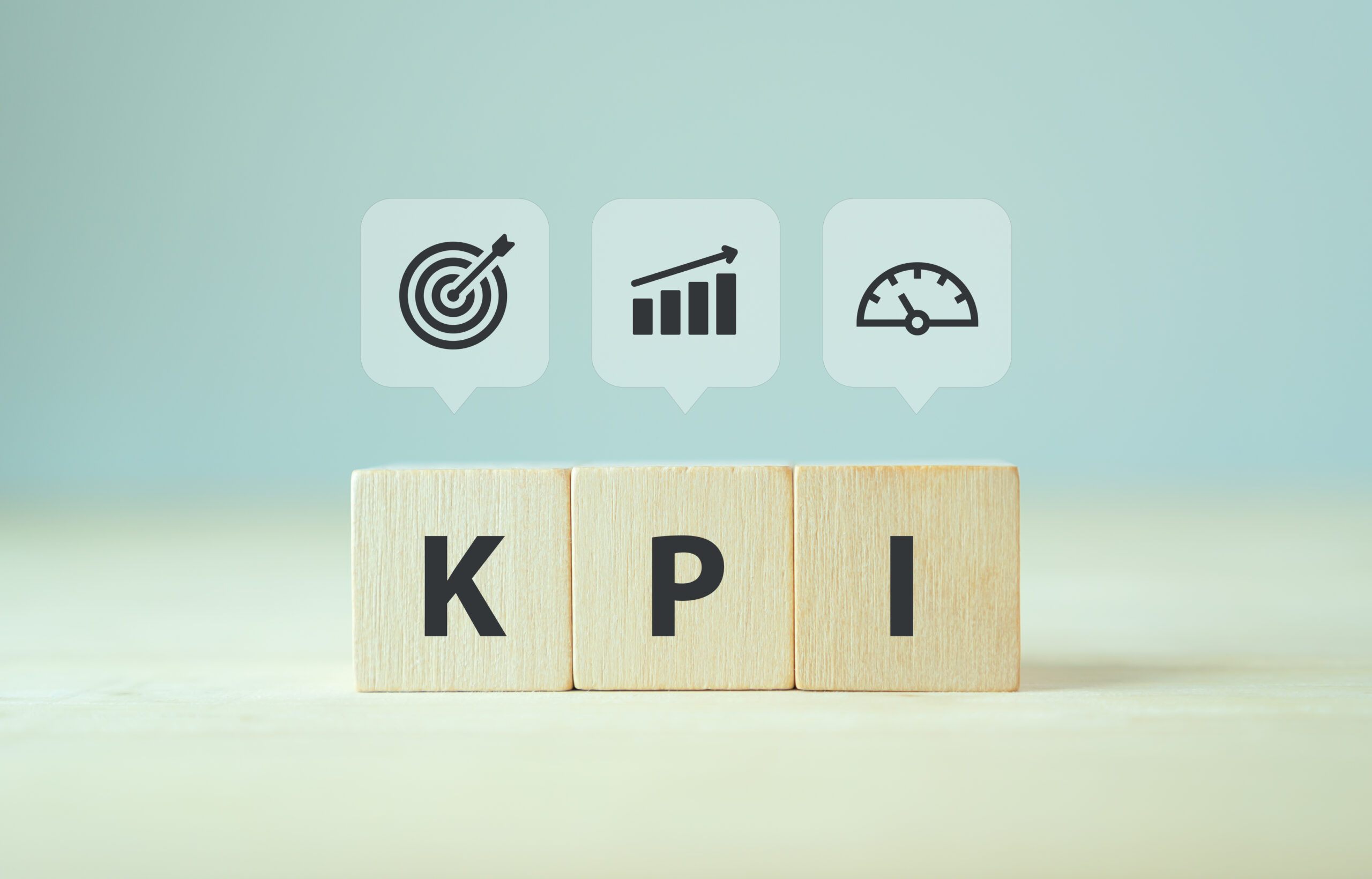 Banner KPI concept. Key Performance Indicator using business intelligence metrics to measure achievement versus planned target. Wooden cubes with “KPI” abbreviation and symbols on smart background.